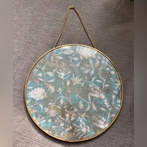 Pretty blue and gold Anthropologie wall decor.